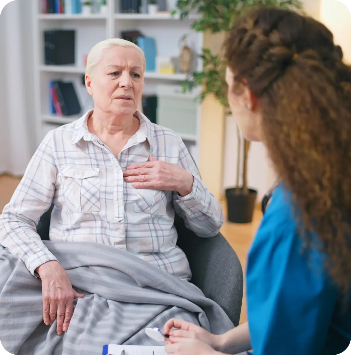 An elderly person talking to a medical professional